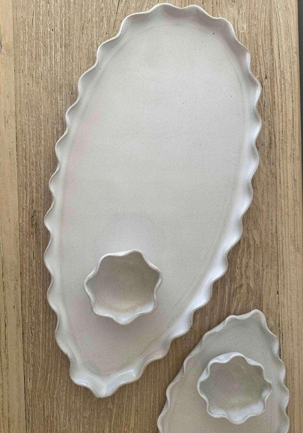 Close-up of the wavy rim on the white ceramic dip bowl