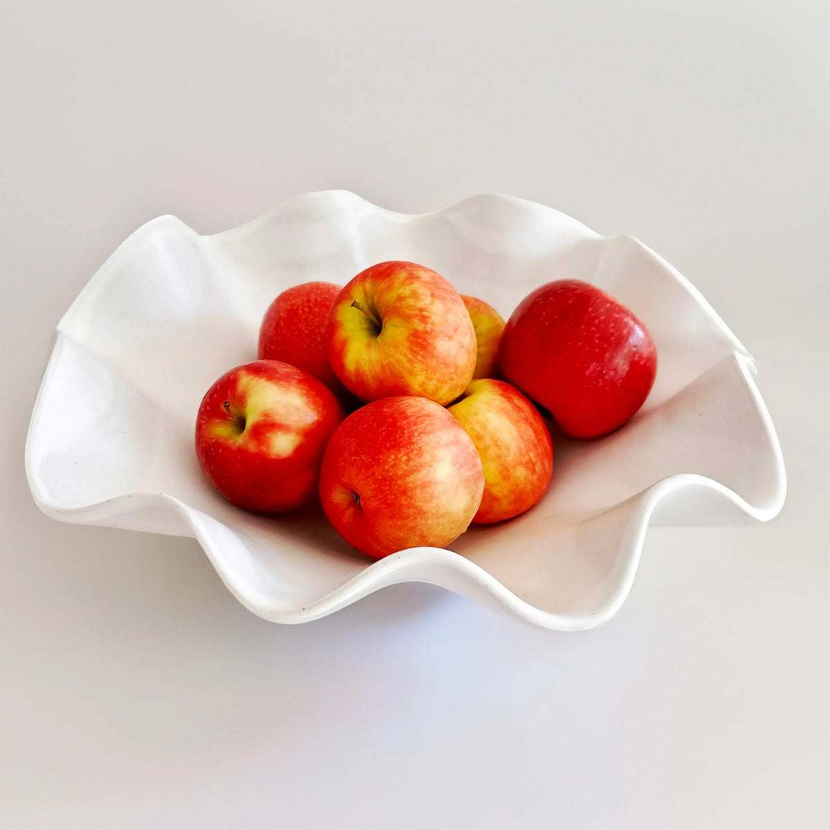 Close-up of the undulating edge on the large white ceramic wave bowl