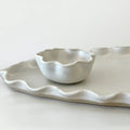 White Wave Dip Bowl by Polly Barton Ceramics shown with matching wave platter