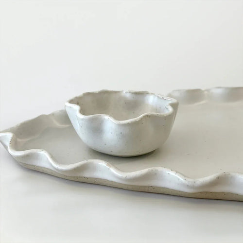 White Wave Dip Bowl by Polly Barton Ceramics shown with matching wave platter