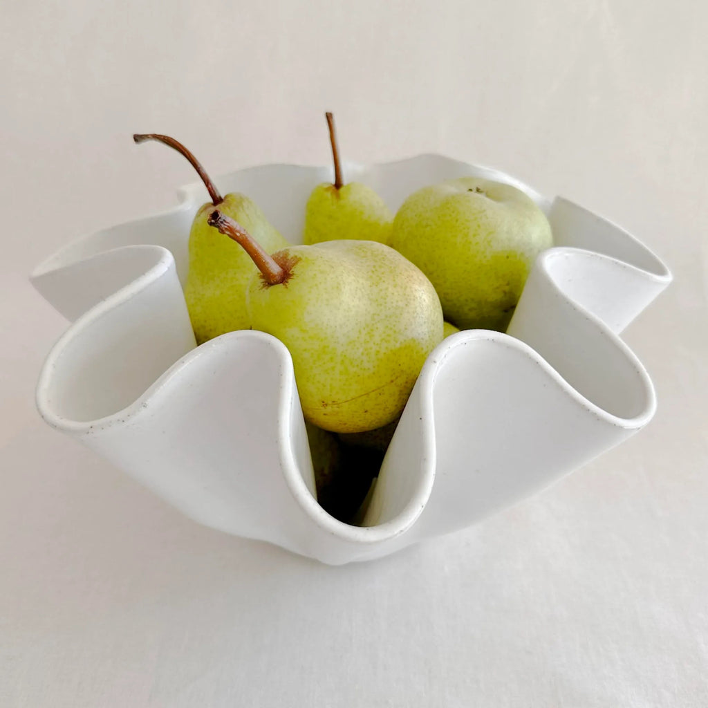 Side profile of the large white high sided wave bowl showing upright rim